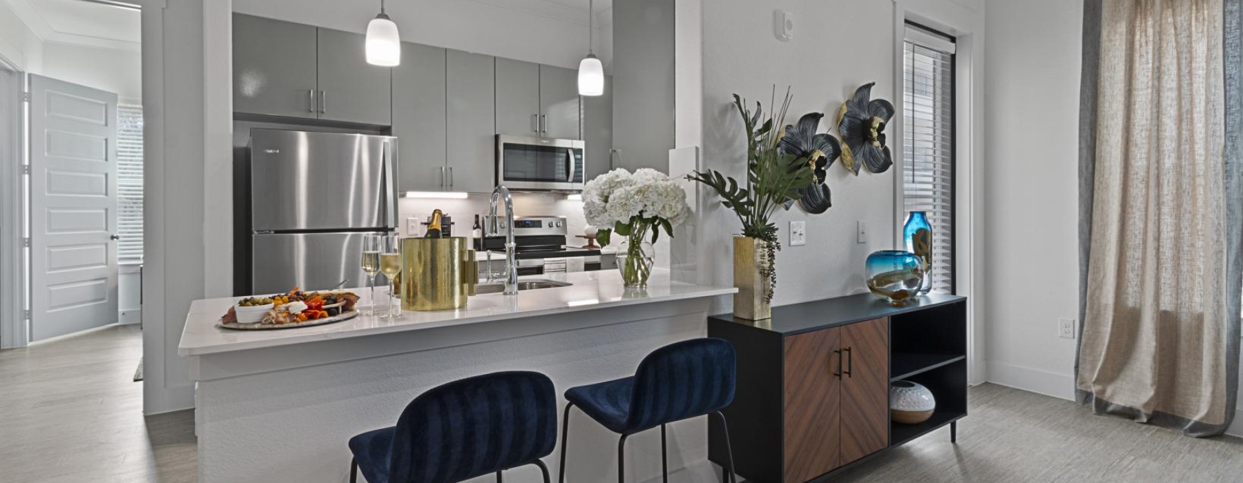 a kitchen with a table and chairs