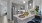 a kitchen with a table and chairs