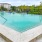 a swimming pool with a fence around it