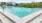 a swimming pool with a fence around it