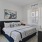 a bedroom with a bed and side tables