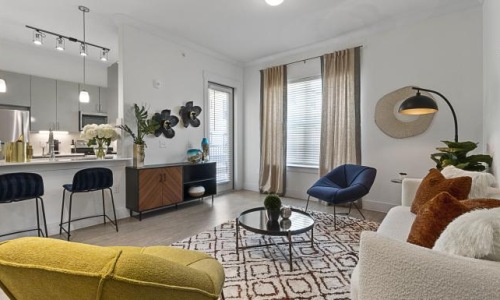 a living room with a couch lamp and a table