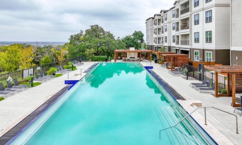 a swimming pool next to a building