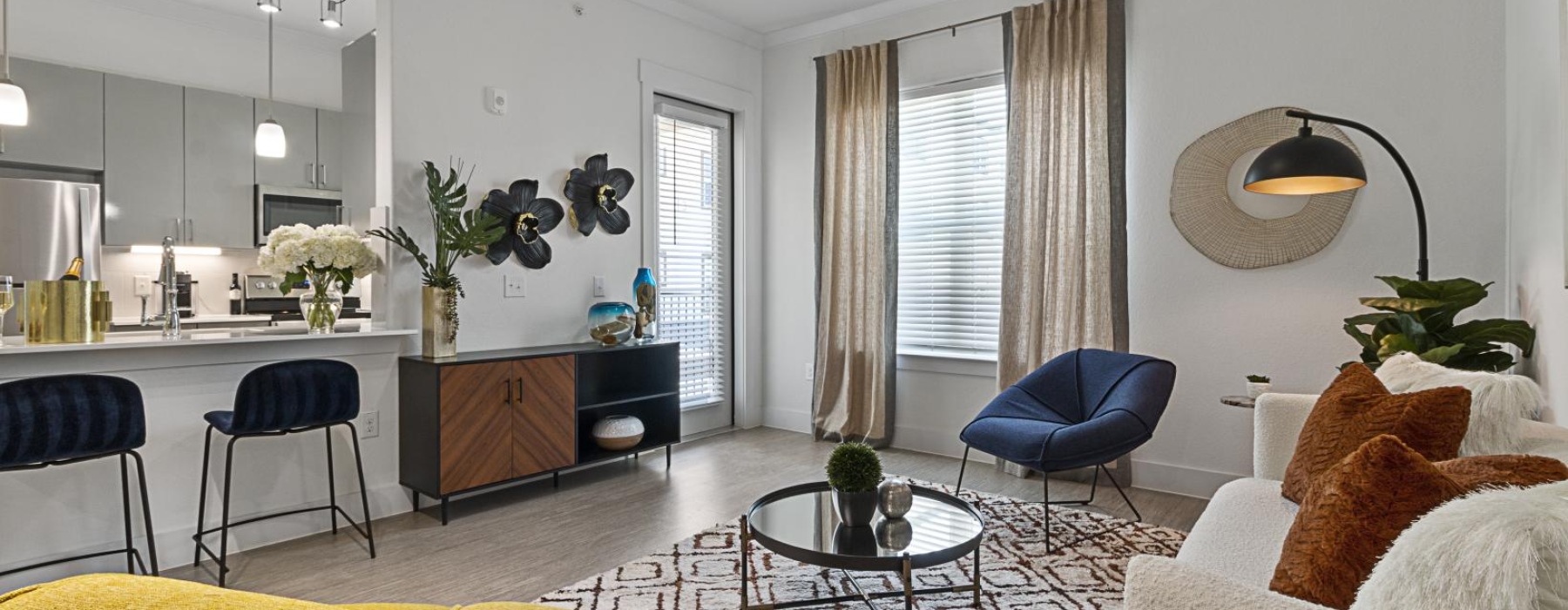 a living room with a couch lamp and a table