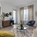 a living room with a couch lamp and a table