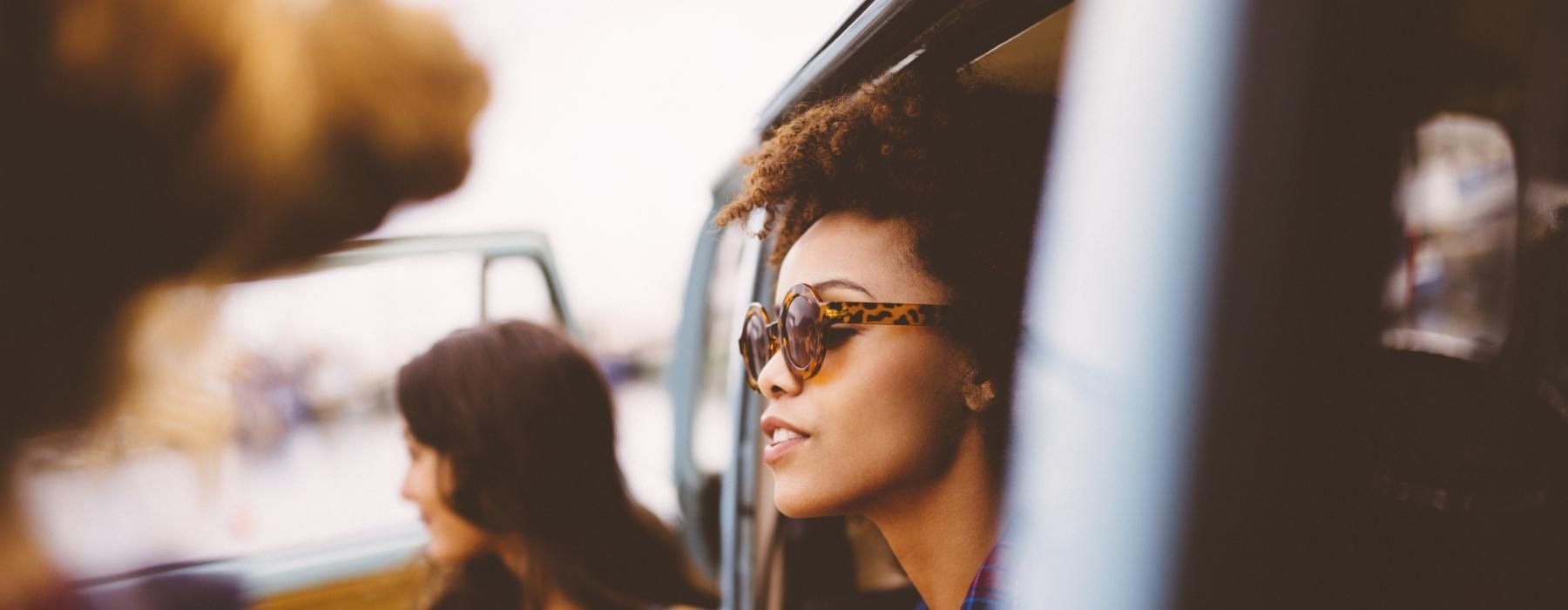 a person looking out the window of a car
