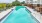 a swimming pool next to a building