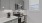 a kitchen with grey cabinets