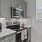 a kitchen with grey cabinets