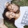 a couple laying on the ground