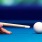 a person playing pool