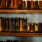 a row of cowboy boots on a shelf